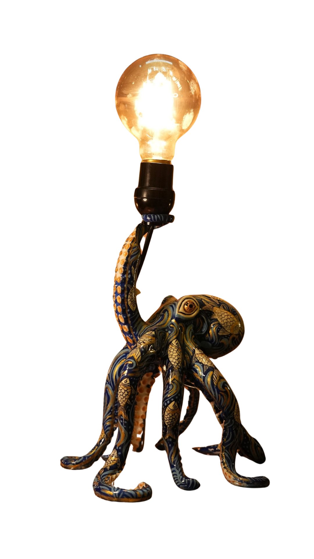 A hand-painted RNDR octopus lamp, edison bulb lit